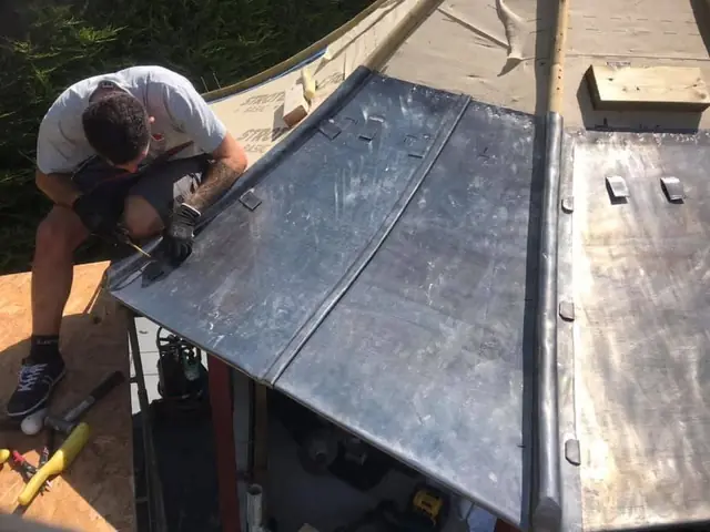 Dressing lead sheets over wood-cored rolls by hand