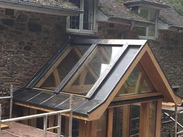 Lead detailing on an oak-framed glass porch roof