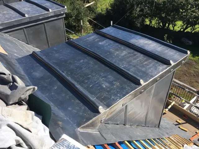 New lead roof with wood-cored rolls