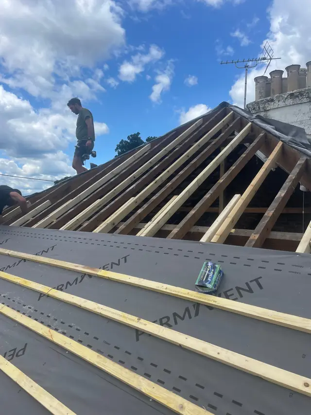 Roof stripped back to the rafters, with new membrane and battens going on