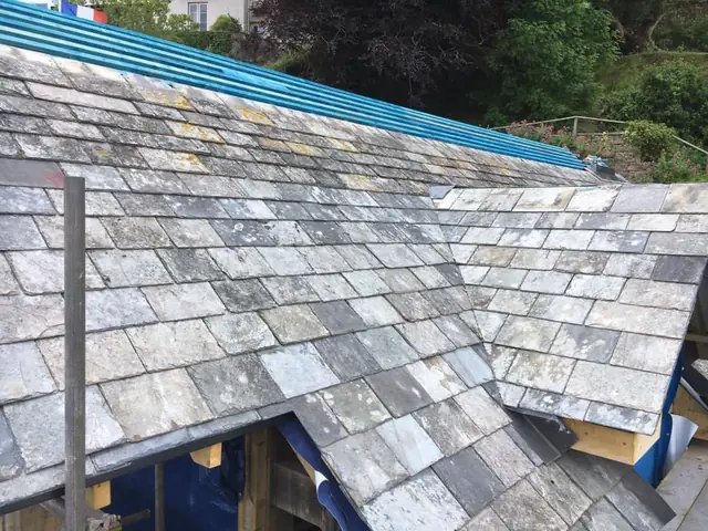 Natural slate roof and valley during repair work