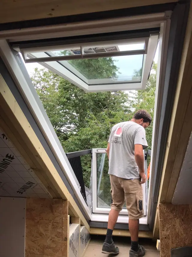 Looking out through an open VELUX Cabrio balcony from inside the room